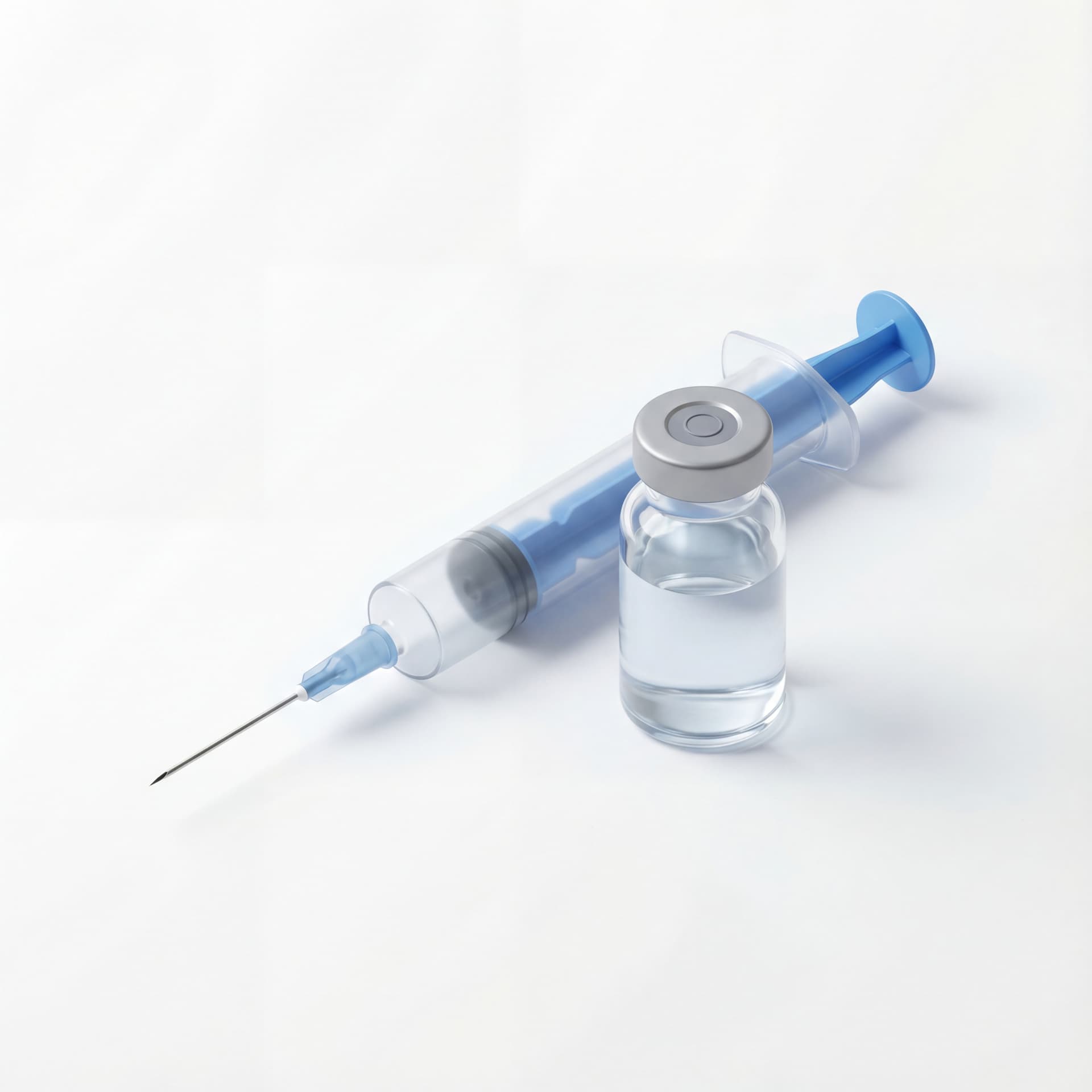 A medical syringe and vaccine vial positioned together in a clean sterile arrangement, professional healthcare context, isolated on a white background.